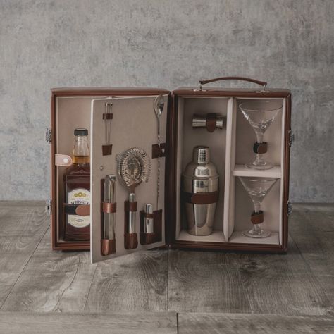 From the Roaring 20s to the 2020s, the Manhattan Portable Cocktail Set brings all that jazz back to happy hour. This complete bartender set is reminiscent of a vintage suitcase with its premium leatherette exterior and fully-insulated interior lined in sleek black velveteen which tastefully showcases your two favorite wine or liquor bottles and the included: two hand-blown 7oz. Martini glasses, stainless steel shaker, stainless steel double-sided jigger, stainless steel ice tongs, stainless stee Bartender Set, Perfect Martini, The Roaring 20s, Manhattan Cocktail, Martini Set, Ice Tongs, Portable Bar, Cocktail Shaker Set, Cocktail Set