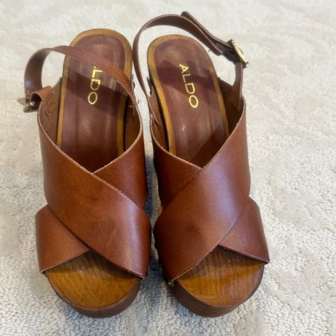 Vintage Aldo Brown Leather (Size 6.5), Wedge Platform Sandals With Metal Gold Studs On Sides, Buckle Closure, And Wooden Heels. Platform Heel 4". Never Worn; There Is A Small Mark On The Bottom Of One Shoe From The Glue Of The Tag. In Perfect Condition, Like New. Brown Platform Wedge Sandals In Synthetic, Brown T-strap Wedge Sandals For Summer, Brown High-heel Wedge Sandals With Heel Strap, Wooden Platform Sandals, Wedge Platform Sandals, Wood Heels, Leather Wedge Sandals With 4-inch Heel, Open Toe, Wooden Heels, Heels Platform