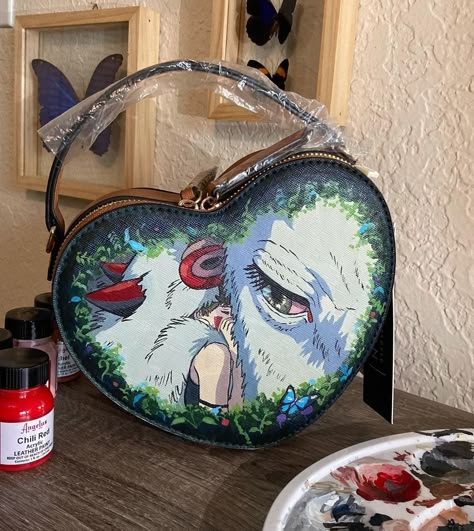 Crystal McQueen 🌞 on Instagram: “#PrincessMononoke hand painted bag 🌱🐺 Decided to do a raffle to help my parents who at this moment are going through a really difficult…” Hand Painted Bags, Denim Jacket Diy Paint, Studio Ghibli Crafts, James Fridman, Bag Painting, Chihiro Y Haku, Diy Denim Jacket, Art Bags, Handpainted Bags