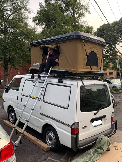 Last week we attached two Pro Rock roof racks to install a Kings pop up rooftop tent which sits on the top of the van, saving heaps of space inside. It sleeps two and can be pushed down and easily straped up with bedding left inside. And getting it up is even easier, you just push it and the gas struts lift it. When it's just me, I'll sleep inside but for two people, the Kings hard top rooftop tent is a great space saving hack and sleeping solution for a small van! Van With Rooftop Tent, Camper Van Pop Up Roof, Small Van Conversion Ideas, Small Van Life Interior, Motorcycle Van, Van Conversion Plans, Roof Rack Tent, Van Inside, Van Tent