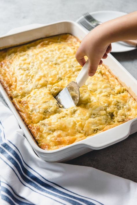 An image of an easy breakfast casserole in a large pan with eggs, cheese, cottage cheese, and green chilies for Christmas breakfast. Green Chili Egg Casserole, Green Chili Casserole, Egg Bake Casserole, Cottage Cheese Breakfast, Egg Casserole Recipes, Queso Feta, Baked Casserole, Green Chili, Egg Casserole