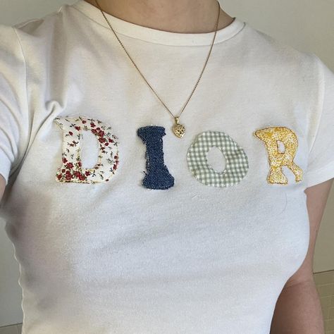 I might be biased but you should probably buy this on Depop 👍 https://depop.app.link/cEJ9wyBNMyb Fabric Letter Shirt, Letter Tshirt, Sewn Letters On Shirt, Patchwork Letter Shirt, Diy Baby Tee Ideas, Sewing Letters On Fabric, Patchwork Baby Tee, Diy Baby Tee, Embroidery Tshirt Ideas