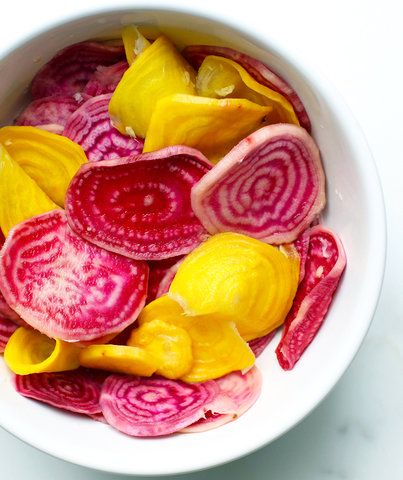 Quick-Pickled Horseradish Beets | This recipe is quick but the results are impressive. Golden or Chioggia beets (which have red and white stripes) make for a pretty, colorful presentation—but if you can’t find either, it’s okay to use red ones. Prepared horseradish has vinegar and salt in it, so you’re half-way to pickling. If you have a mandolin on hand, it’ll help you slice the beets thinly, quickly, and evenly. The beets soften considerably during pickling, but retain a bit of pleasant cr... Pickled Shredded Beets, Picked Beets, Pickled Beets With Cinnamon And Cloves, Old Fashioned Pickled Beets, Diy Pickles, Quick Pickled Radish, Lactose Free Cheese, Chioggia Beets, Horseradish Recipes