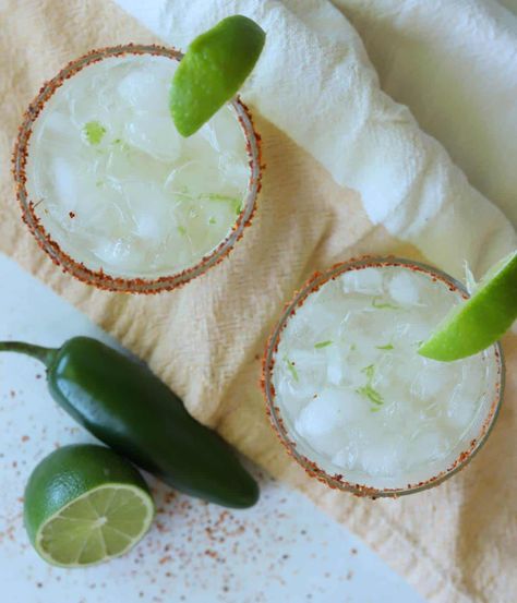 These Tajin Margaritas are the perfect drink for Cinco de Mayo. Freshly squeezed lime juice meets tajin for a flavor packed cocktail. Tajin Recipes Drink, Drinks With Tajin Rim, Spicy Margarita Recipe Tajin, Mango Tajin Drink, Tajin Rim Margarita, Lime Margarita, Frozen Drinks, Lime Juice, Juice