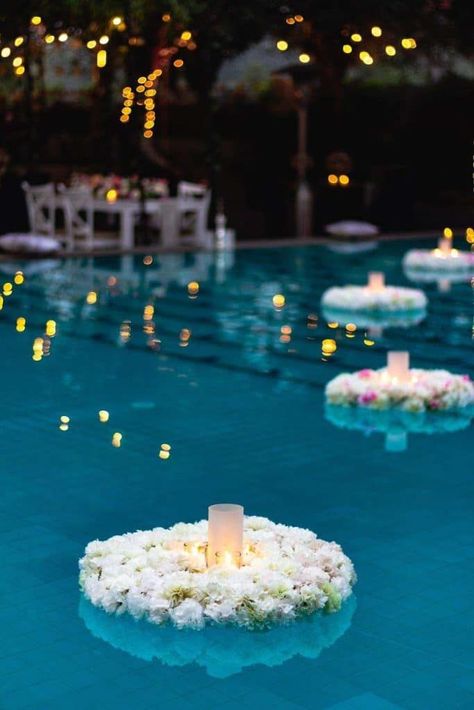 Light up the pool during your outdoor party and enjoy its magical vibe! Make floaters and use that to place candles and lanterns. Beautiful! Read our post for more lighting ideas for a cozy outdoor party! Wedding Pool Party Decorations, Pool Wedding Decorations, Pool Candles, Wedding Pool Party, Pool Wedding, Poolside Party, Outdoor Dinner Parties, Pool Party Decorations, Wedding Mandap