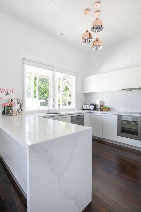 The U-Shaped kitchen layout is perfect for homeowners lacking space or looking to optimize their existing kitchen design. With three walls of cabinets and counter tops, the U-shaped design provides plenty of space and functionality. It also provides an efficient kitchen work triangle for cooking connoisseurs. Visit our latest blog to learn more about how to optimize a U-shaped kitchen design. Celebrity Kitchens, U Shaped Kitchen, White Kitchen Design, Kitchen Benches, White Modern Kitchen, Simple Kitchen, Kitchen Inspiration Design, Kitchen Inspo, Trendy Kitchen