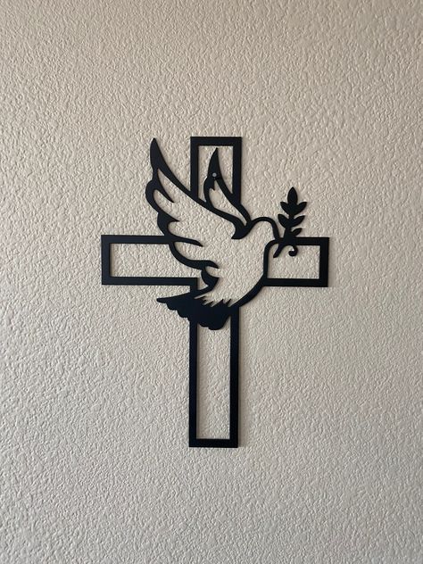 "Christian Catholic Holy Spirit Dove Cross metal sign. Beautiful metal sign for your living room or prayer corner! Each sign is made from heavy duty 16 gauge metal and powder coated matte black with an optional white background. Mounts on wall very easily with a simple nail in drywall. 13\" tall by 9.5\" wide. If you are local and would like to save the cost of shipping and pickup yourself please message me for a PROMO code before purchasing to save some" Sheet Metal Art, Religous Tattoo, Christian Metal, Holy Spirit Dove, Catholic Altar, Foam Art, Diy Crafts Bookmarks, Prayer Corner, Sign Of The Cross