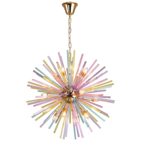 Introducing the Afralia™ Dandelion Pendant Lamp, a vibrant chandelier designed to illuminate and elevate modern, colorful rooms with a touch of whimsy and style. This exquisite piece of lighting fixture is meticulously crafted to add a pop of charm and sophistication to any space. Certified by renowned organizations such as CCC, CQC, GS, pse, SAA, UL, and VDE, this chandelier meets the highest standards of quality and safety. The inclusion of LED bulbs ensures energy efficiency and long-lasting illumination, while the dimmable feature allows for customizable lighting to suit any mood or occasion. The crystal body of the Afralia™ Dandelion Pendant Lamp exudes elegance and glamour, while the iron finish adds a contemporary edge to its design. The upward shade direction and flush mount instal Kids Chandelier, Modern Light, Chandelier Design, Rainbow Crystal, Plum Blossom, Led Pendant Lights, Pastel Hues, Hanging Light, Dream House Decor