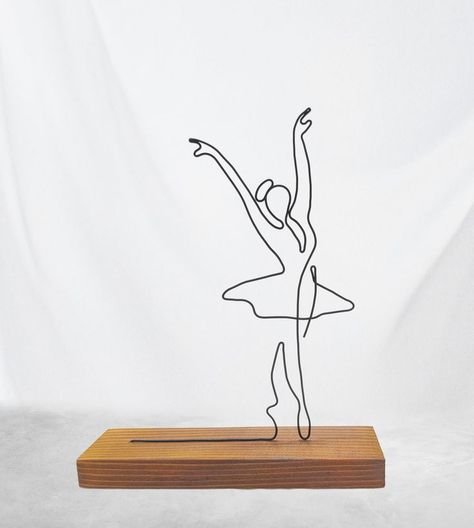 Ballerina Wire Art Sculpture tabletop decor. Hand-shaped from single steel wire, sitting on a solid fir tree coaster. The wire is colored with matte black acrylic paint, and the coaster is colored with an eco-friendly teak tree wood protector. Ballerina Drawing, Minimal Home Decor, Drawing Female, Wire Wall Art, Drawing Female Body, Diy Plaster, Wire Art Sculpture, Black Acrylic Paint, Kids Art Class