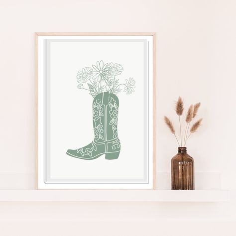 Western floral sage green Cowboy Boot Wall Art Print, sage green Cowboy Boot Digital download Prints, Gallery Art, Trendy sage green cowgirl boots Looking for a fun and trendy way to decorate your living room or bedroom? Look no further than these floral cowboy boots art printables! These prints are perfect for any western-themed room, and they're also a great way to show your love for the cowboy lifestyle. Not only are these prints stylish, but they're also functional - making them the perfect Green Art For Bedroom, Cowgirl Boots Picture, Western Room Decor Bedroom, Western Printables, Green Cowgirl Boots, Cowboy Boots Art, Vintage Western Art, Dorm Room Paintings, Boot Wall