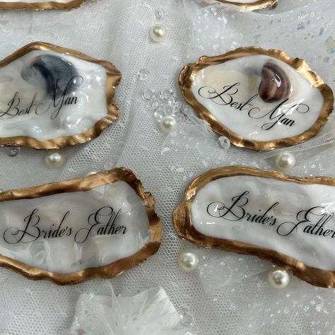 Flat Oyster Table Place Cards, Gold & Natural Place Cards https://www.etsy.com/listing/1748141079 These flat (not cupped) personalized oyster shells are the perfect way to🥂 𝓦𝓸𝔀 your guests at your coastal wedding or event. Your guest will be surprised to know that they have a very special keepsake to take with them. Your tables will be stunning and elegant with the table numbers on these shells that match the guest’s keepsakes. A thoughtful gift that they will always cherish on their very spe... Oyster Table, Natural Place, Table Place Cards, Coastal Wedding, Oyster Shells, Time Design, Table Numbers, Place Cards, Thoughtful Gifts