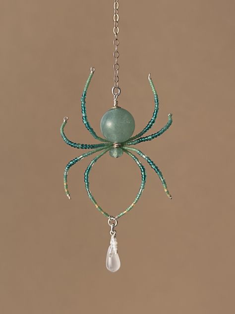 This unique and delicate spider pendant is handcrafted using solid 925 sterling silver wire and components. The body of the spider features a natural aventurine gemstone bead and the legs are intricately crafted using beautiful vintage Czech glass seed beads. Wire Wrapped Circle Pendant, Animals Out Of Beads, Spider Wrapping Prey, Microbeads Crafts, Wire Spider Tutorial, Beaded Spider Tutorial, Bead Projects Diy, Trending Beaded Jewelry, Insect Jewelry Diy