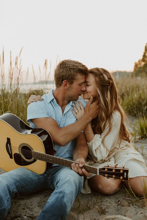 a romantic beachside engagement session with some soft guitar tunes at sunset Couples With Guitar, Musician Couple Photography, Couple Guitar, Guitar Engagement Photos, Couple Photo With Guitar, Guitar Engagement Pictures, Couple Photos With Guitar, Guitar Couple, Couples Playing The Guitar