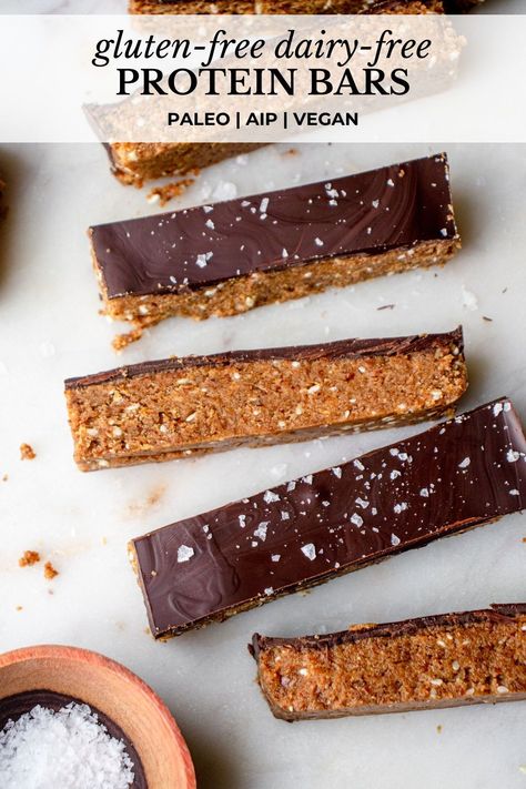 These are the Best Gluten-Free Dairy-Free Protein Bars! They’re soft and fluffy, packed with fiber and protein, and topped with a smooth chocolate coating. These homemade, no-bake paleo protein bars are vegan- and Modified AIP-friendly. They’re the perfect grab-and-go snack or wholesome treat! #proteinbars #glutenfreedairyfreerecipes #glutenfreeproteinbars #dairyfreeproteinbars #paleoproteinbars #nobakeproteinbars #soyfreeproteinbars #veganproteinbars #aipproteinbars #diyproteinbars Raw Protein Bars Recipe, Vegan Protein Bars Homemade, Paleo Protein Bars Homemade, Paleo Protein Bar, Gluten Free Protein Bars Homemade, Aip Protein Snacks, Sugar Free Protein Bars Homemade, Homemade Healthy Protein Bars, Paleo High Protein Snacks