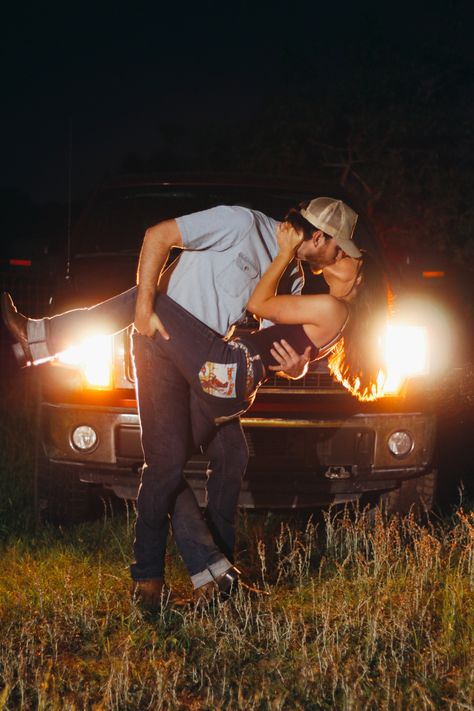 Country couple photo shoot idea -truck headlights photo shoot Truck Light Photoshoot, Wedding Photo With Truck, Headlight Couples Photoshoot, Matching Trucks Couples, Headlight Couple Pictures, Couple And Truck Photography, Couple Poses In Front Of Car, Headlights Couple Photoshoot, Sports Car Couple Photoshoot