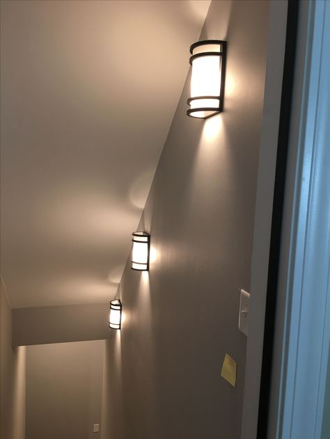 Wall Going Down To Basement, Basement Staircase Lighting, Basement Stairs Lighting Ideas, Going Down Basement Stairs, Light Fixtures For Stairwell, Basement Stair Lighting Fixture, Basement Stairwell Ideas Modern, Farmhouse Stair Lighting, Sconces In Stairwell