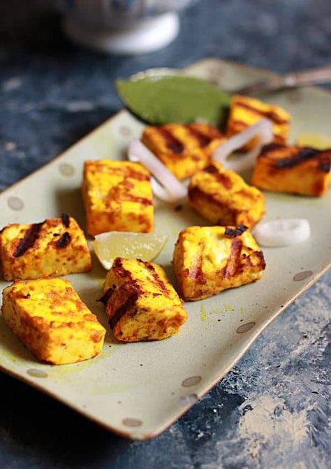 Grilled paneer recipe- an easy to make quick and delicious paneer snack or starter that you can make in 20 minutes flat. Soft and juicy paneer cubes with those charred grill marks will sure be a hit in any party or a special snack for toddlers and kids! This is a quick version of classic paneer tikka with minimum ingredients. Here is a quick recipe of grilled paneer with video for you all :) Recipe via cookclickndevour.com #paneer #grilledpaneer #paneerstarters #cooclikcndeveour Grilled Paneer Recipes, Paneer Starters, Paneer Snacks, Easy Paneer Recipes, Recipes For Toddlers, Grilled Paneer, Tandoori Paneer, Paneer Dishes, Tikka Recipe