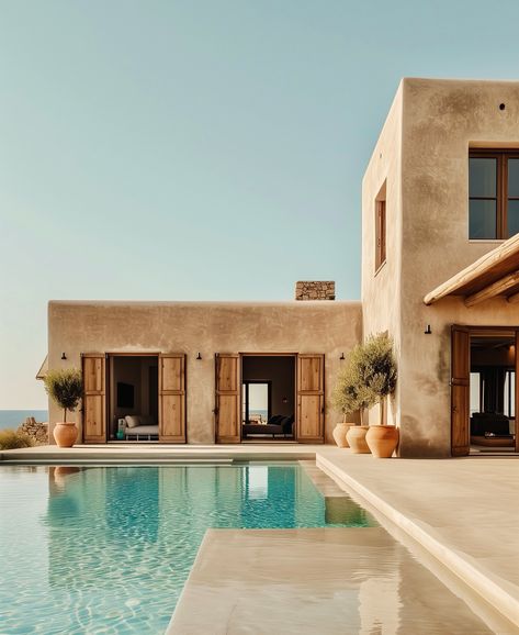 Perched on top of a hill, with its infinity pool looking at the Mediterranean. Minimalist lines, earthy tones, and open spaces that blend indoor and outdoor living areas. Welcome to C+A Residence in Greece. @giuseppe_sama_design_studio Pueblo Style House, Pool Design Plans, Minimal Houses, Mediterranean Houses, Mediterranean House Design, Tuscan Architecture, Mediterranean Homes Exterior, Mediterranean Exterior, Outdoor Pool Area