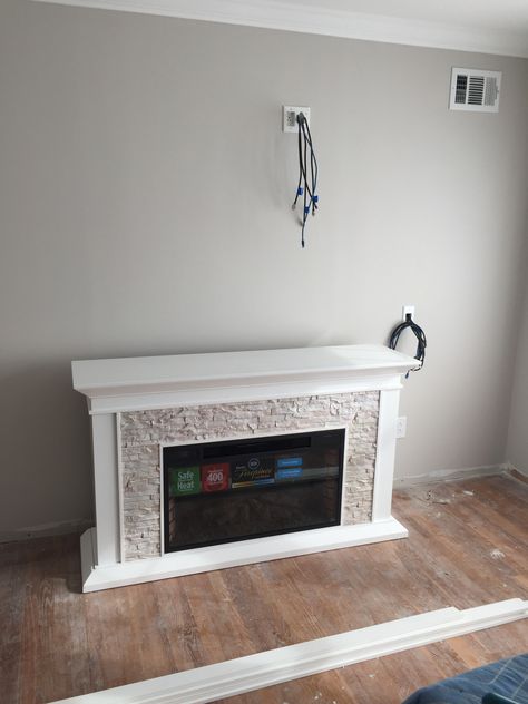 Paint is Behr Dove, fire place is from wayfair Gravel Stone Behr Paint, Behr Dove Paint Living Rooms, Behr White Trim Paint, Dove By Behr, Dove Behr Paint Living Room, Dove Paint Color Behr, Dove Behr Paint, Behr Dove Paint Wall Colors, Behr Dove