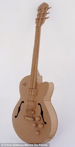 The artist who makes sculptures of everyday objects using cardboard Cardboard Guitar, Cardboard Art Sculpture, Cardboard Props, Cardboard Model, Cardboard Design, Cardboard Toys, Cardboard Sculpture, Sculpture Projects, Cardboard Art