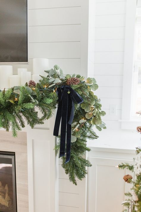 Christmas decor The designer added navy velvet ribbons on both sides of the garlands Christmas decor Christmas decor Christmas decor Christmas decor #Christmasdecor #christmasgarland #garland Christmas Mantles, Greenery Christmas, Mantel Garland, Blue Christmas Decor, Christmas Bathroom Decor, Christmas Bathroom, Christmas Mantel, Christmas Tablescape, Christmas Kitchen Decor