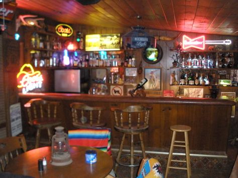 western bar w/ poker tables, lanterns, etc 60s Basement Bar, Country Bar Aesthetic, Western Saloon Bar, Western Bar Decor, Pallet Backyard, Slat Doors, Cheap Bar, Saloon Bar, Saloon Doors