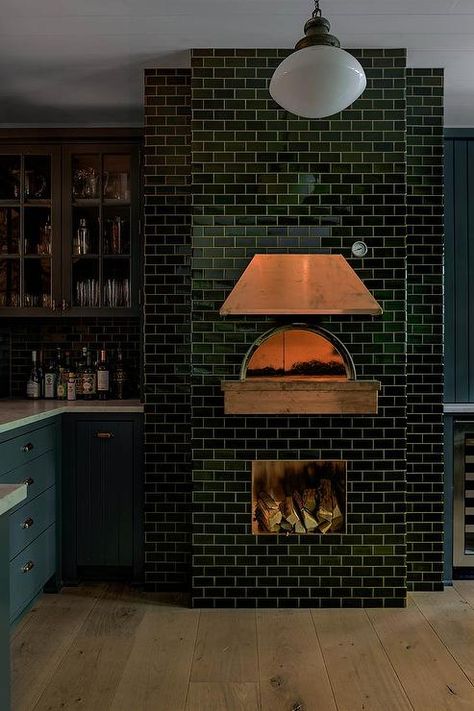 A black subway tiled pizza oven is finished with a copper hood. Indoor Pizza Oven, Outdoor Pizza Oven Kits, Pizza Oven Fireplace, Black Subway Tiles, Wood Burning Pizza Oven, Copper Hood, Brick Oven Pizza, Brick Pizza Oven, Wood Oven