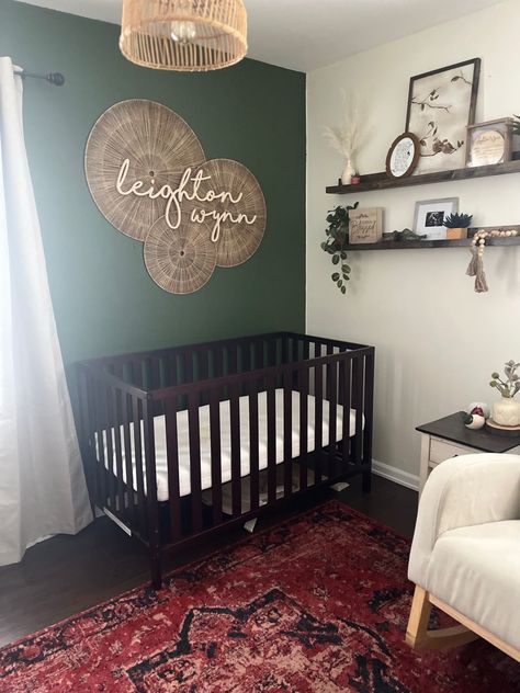 Gender Neutral Nursery With Dark Wood Crib, Dark Green And Beige Nursery, Dark Green Baby Girl Nursery, Green Nursery With Dark Furniture, Green And Dark Wood Nursery, Forest Green Accent Wall Nursery, Dark Floor Nursery, Deep Green Nursery, Dark Nursery Furniture