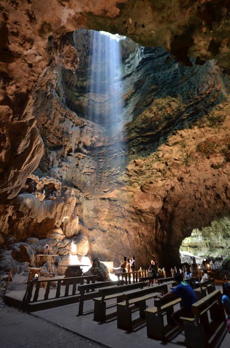 Callao cave chapel The Callao Cave Chapel. The first of the seven chambers converted into a worship place by adding an altar and wooden benches. Light rays filtered through the foliage in the cave ceiling's hole. by Cesar Cambay Fiance Visa, Anglesey Wales, Filipino Architecture, Visit Philippines, Philippines Beaches, Wooden Benches, Landscape Rock, Philippines Culture, Village Photos