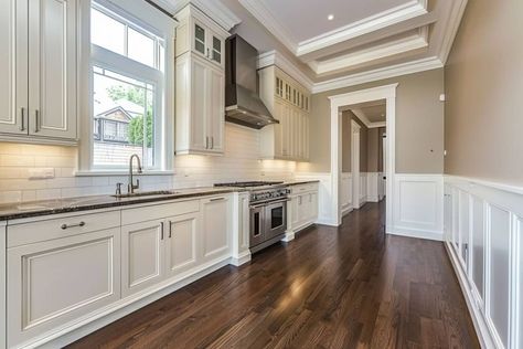 kitchen with white wainscoting and wood floor Wainscotting In Kitchen, Wainscoting Kitchen Walls, Kitchen Wainscoting Ideas, Wainscoting In Kitchen, London Flat Kitchen, Kitchen Wainscoting, Waynes Coating, Wainscoting Kitchen, Two Tone Walls