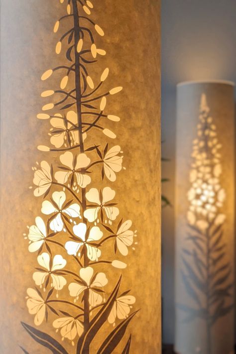 Glowing handmade parchment paper lamps with cut out nature designs by Hannah Nunn Rosebay Willowherb, Paper Lamps, Nature Designs, Handmade Lampshades, Lamp Handmade, Candle Cover, Rustic Lamps, Bedside Lighting, Lasercut Design