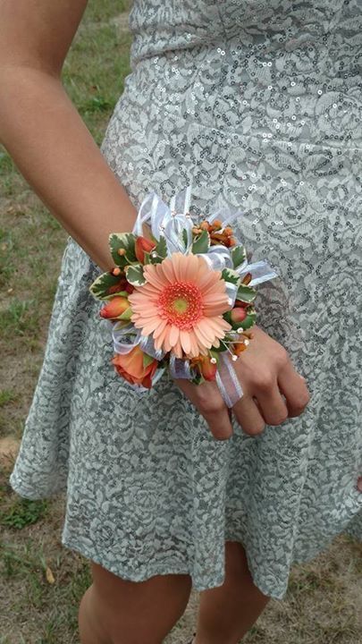 Wrist corsage, roses and gerbera daisy, coral and peach