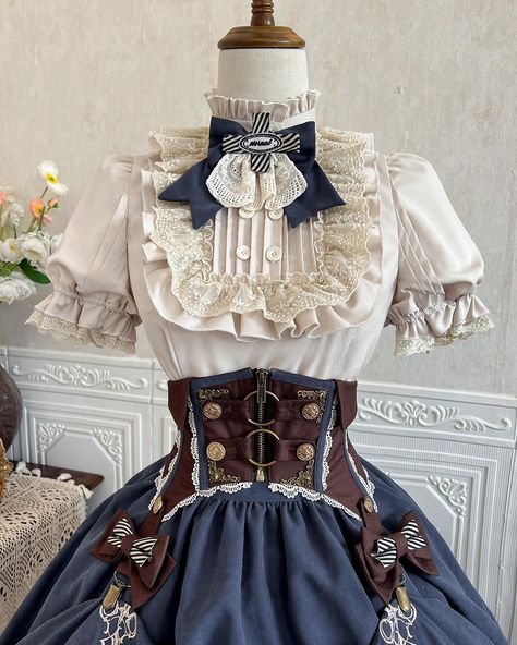 🥰Steampunk Lolita outfit: apricot ruffle neckline shirt, brown corset belt and blue skirt. 👉Search 'XDJ-150' on devilinspired.com #devilinspired #steampunk #punklolita #lolitacoord #lolitafasion #punkoutfits Lolita Outfit, Brown Corset, Bowknot Dress, Short Sleeves Shirt, Lolita Outfits, Clothing Design Sketches, Dress Design Sketches, Kawaii Dress, Corset Belt