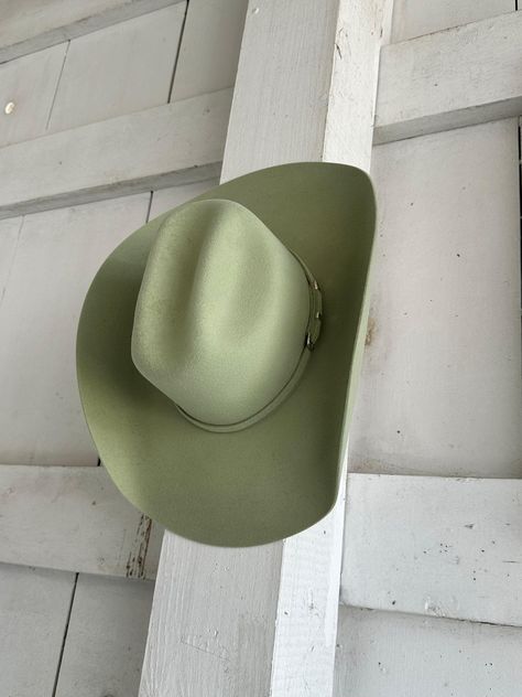 Looking for a cowboy hat that's as stylish as it is functional? Look no further than the Serratelli Mesa Cowboy Hat! Serratelli Hats are a statement piece rooted in true western heritage. With over 100 years experience, Serratelli knows how to make a cowboy hat look and feel great. Crafted from pure wool construction, Green Western Aesthetic, Green Cowgirl Hat, Make A Cowboy Hat, Green Cowboy Hat, Western Hat, Cowgirl Aesthetic, Western Cowboy Hats, Pistachio Green, Matching Hat