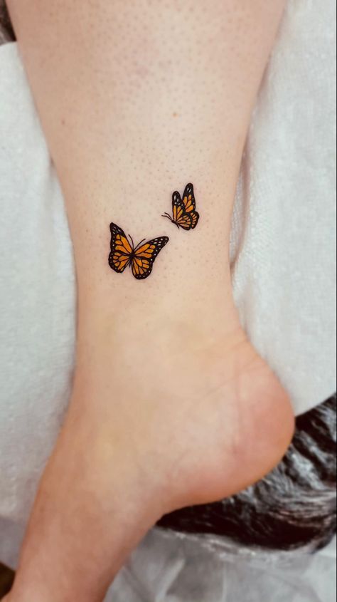 Got my first tattoo. A couple of monarch butteflies for my son and I. We raise them from caterpillers every year in our butterfly garden. Love the detail! So worth it! Butterfly With Color Tattoo, Colorful Monarch Butterfly Tattoo, Monarch Butterfly Memorial Tattoo, Monarch Butterfly Tattoo Placement, Monarch Butterfly Wrist Tattoo, Monarch Tattoos Butterfly, Small Orange Butterfly Tattoo, Mini Monarch Butterfly Tattoo, Different Color Butterfly Tattoo