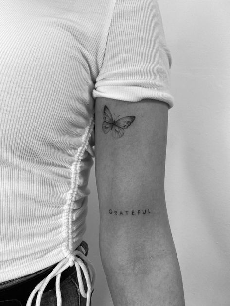 Tattoo Beautiful Word, Back Arm Word Tattoo, Small Word Tattoos Arm, Fine Line Tattoos On Arm, Words On Bicep Tattoo, Grateful Quotes Tattoo, Word And Butterfly Tattoo, Grateful Arm Tattoo, Family Simple Tattoo