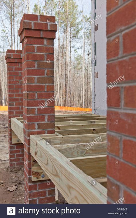 New home construction wood framing details of a porch with brick columns Stock Photo Brick Post Columns, Brick Pillars Porch, Brick Columns Porch, Stairs Backyard, Brick Pillars, Brick Porch, Brick Columns, Wooden Columns, House Front Porch