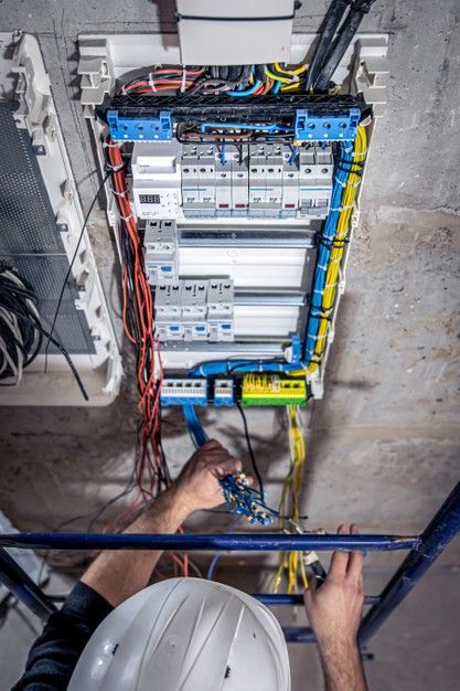 A male electrician works in a switchboar... | Free Photo #Freepik #freephoto #house #man #construction #work Electrician Social Media Post, Electrician Wallpaper, Electrician Aesthetic, Electricity Aesthetic, Electric Wallpaper, Electrical Estimating, Exposed Wiring, Electricity Logo, Electric Man