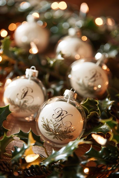 Step into a wedding winter wonderland! 🎄✨ Discover the charm of unique wedding keepsakes with bespoke ornaments featuring the newlyweds' initials. Perfectly nestled amidst evergreen holly and the magical shimmer of fairy lights, these favors are a hit with guests! #WeddingInspiration #WinterWedding #ChristmasWedding #WeddingFavors #CustomFavors #BrideToBe #WeddingDecor #FestiveWedding Christmas Ornaments Wedding Favors, Winter Wedding Favors For Guests, Christmas Ornament Wedding Favors, White Christmas Wedding, Wedding Winter Wonderland, Initial Ornaments, Unique Wedding Keepsakes, Ornament Wedding Favors, Evergreen Wedding