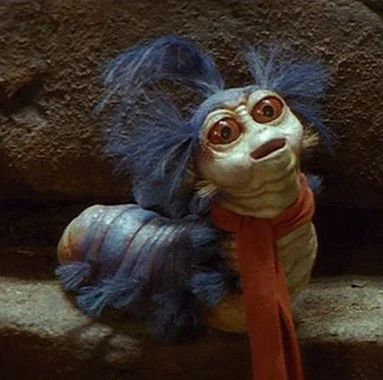 The worm is a small creature who lives in Jareth's Labyrinth, and is a featured character in the film of the same name. The Worm was operated by Karen Prell, and was voiced by the late Timothy Bateson. The worm is extremely hospitable, and offers Sarah guidance when she is at the point of giving up her quest to save her brother. He has a cockney accent, and wears a bright red scarf. Labyrinth Party, Labyrinth Worm, Rattus Rattus, Labyrinth Ball, Labyrinth Jareth, Labyrinth Art, Labyrinth 1986, Labyrinth Movie, Brian Froud