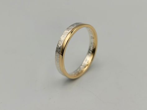 "This is a two tone hammered ring which consists of one ring made of sterling silver and another made of 14K gold which have been soldered together. The silver is hammered and the gold part in contrast is glossy. A unique wedding ring comfortable to wear from men and women! It is a made of order ring and you can choose either 4.5mm width as a wider option or 3.5mm width a thinner one. The first has 3.0mm sterling silver and 1.5mm 14K gold and the thinner has 2.00mm silver and 1.5mm 14K gold. DET Mens Wedding Rings Gold And Silver, Wedding Ring Mixed Metals, Mixed Metal Wedding Bands, White And Yellow Gold Ring, Silver And Gold Jewelry Mixing Rings, Two Tone Engagement Ring Mixed Metals, Mixed Metal Wedding Ring, Gold And Silver Wedding Band, Silver And Gold Jewelry Mixing