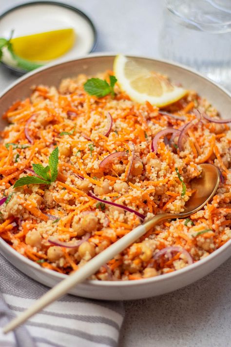 This no-cook Moroccan Carrot Salad with Chickpeas is fun, light, and flavorful. Fluffy couscous is combined with fresh vegetables and chickpeas, then tossed in a Moroccan-spiced dressing. Enjoy a bowl for a satisfying lunch or summer side dish. Moroccan Carrot, Moroccan Carrot Salad, Salad With Chickpeas, Moroccan Carrots, Moroccan Salad, Summer Side Dish, Vegan Guide, Couscous Salad, Summer Side Dishes