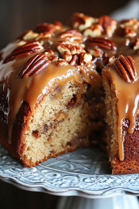 This Apple Pecan Cake with Caramel Glaze is an irresistible dessert filled with tender apple chunks, crunchy pecans, and warm spices, all brought together by a luscious homemade caramel sauce drizzled over the top. It’s a perfect combination of flavors in every bite! I can never get enough of apple cake – the soft, sweet Apple Cake Caramel Icing, Apple Walnut Cake With Caramel Glaze, Banana Caramel Pecan Cake, Apple Pecan Cake With Caramel Glaze, Apple Pie Bundt Cake, Caramel Pecan Desserts, Apple Pecan Bundt Cake, Apple Pecan Cake Recipe, Fancy Thanksgiving Desserts