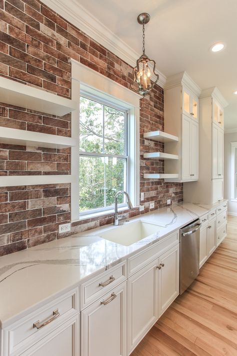 Exposed brick & floating shelves! Open Brick Kitchen, White Cabinets With Brick Backsplash Open Shelving, Brick In Kitchen Ideas, Floating Shelves Brick Wall, Brick Wall Kitchen Backsplash, Brick Tile Wall Kitchen, Brick And White Kitchen, Small Brick Kitchen, Floating Shelves On Brick Wall Kitchen