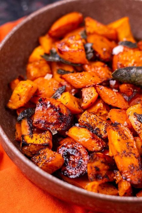 Roasted Sweet Potatoes and Carrots with Crispy Sage Butter Roasted Sweet Potatoes And Carrots, Savory Sweet Potatoes, Sweet Potatoes And Carrots, Pork Side Dishes, Savory Sweet Potato Recipes, Sweet Potato Side Dish, Sweet Potato Sides, Potatoes And Carrots, Cubed Sweet Potatoes