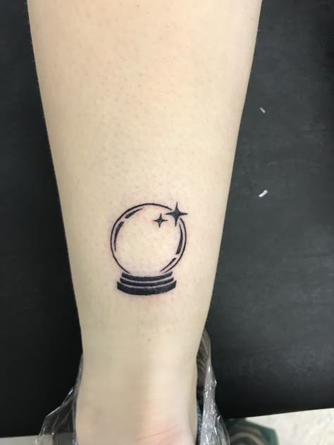 Fortune Ball Tattoo, Small Crystal Ball Tattoo, Crystal Ball Tattoo Ideas, Magic Ball Tattoo, Snow Globe Tattoo, Small Witchy Tattoos, Spark Tattoo, Crystal Ball Tattoo, Oz Tattoo