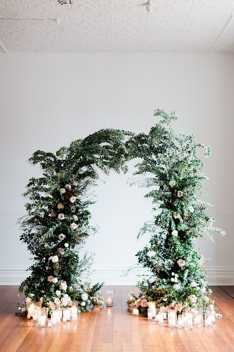 lush greenery winter wedding arch ideas Winter Floral Backdrop, Wedding Arch Ideas Winter, Winter Backdrop Wedding, Winter Wonderland Bridal Shower Decor, Winter Backdrop Photography, Winter Floral Arch, Winter Wedding Arch Flowers, Winter Wonderland Wedding Backdrop, Winter Wonderland Flowers