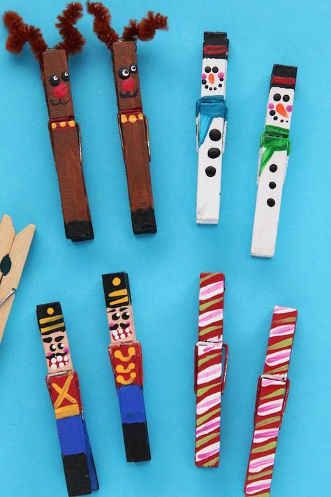 These painted clothespin Christmas ornaments are easy to make with just wooden clothespins and paint. They clip right to your Christmas tree, an evergreen garland or a string of Christmas lights. Make our reindeer, snowmen, candy canes and nutcrackers, or use your imagination to come up some creative ideas of your own. #HappyHooligans #HomemadeOrnament #Christmas #Craft #Kids #Art #Clothespin #Snowman #Reindeer #CandyCane #NutCracker Crafts #Tweens #Teens Reindeer Closepin Craft, Snowman Clothespin Ornaments, Clothpin Crafts Christmas, Christmas Clothespins Crafts, Clothes Pin Reindeer Ornament, Clothes Pin Reindeer Crafts, Clothes Peg Christmas Crafts, Craft With Clothes Pins, Christmas Clothes Pin Crafts