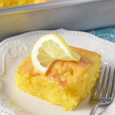 Make my family’s favorite lemon cake recipe, perfect for your next potluck or cookout. Deliciously drizzled with a lemon glaze, it’s an easy, moist, scrumptious dessert! Lemon Sheet Cake Recipe, Lemon Poke Cake, Easy Lemon Cake Recipe, Easy Icing Recipe, Lemon Cake Mix Recipe, Poke Cake Lemon, Box Cake Recipes, Lemon Cake Easy, Lemon Jello