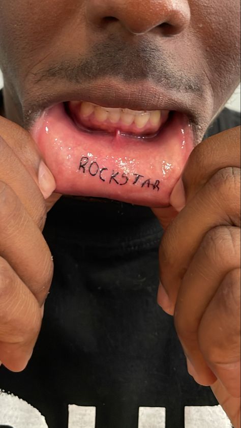 Lip Tattoo Men, Lower Lip Tattoo, Mouth Tattoo Inner Lip, Inner Lip Tattoo Words, Underlip Tattoo, Under Lip Tattoo, Bottom Lip Tattoo, Inner Lip Tattoo Ideas, Rockstar Tattoos